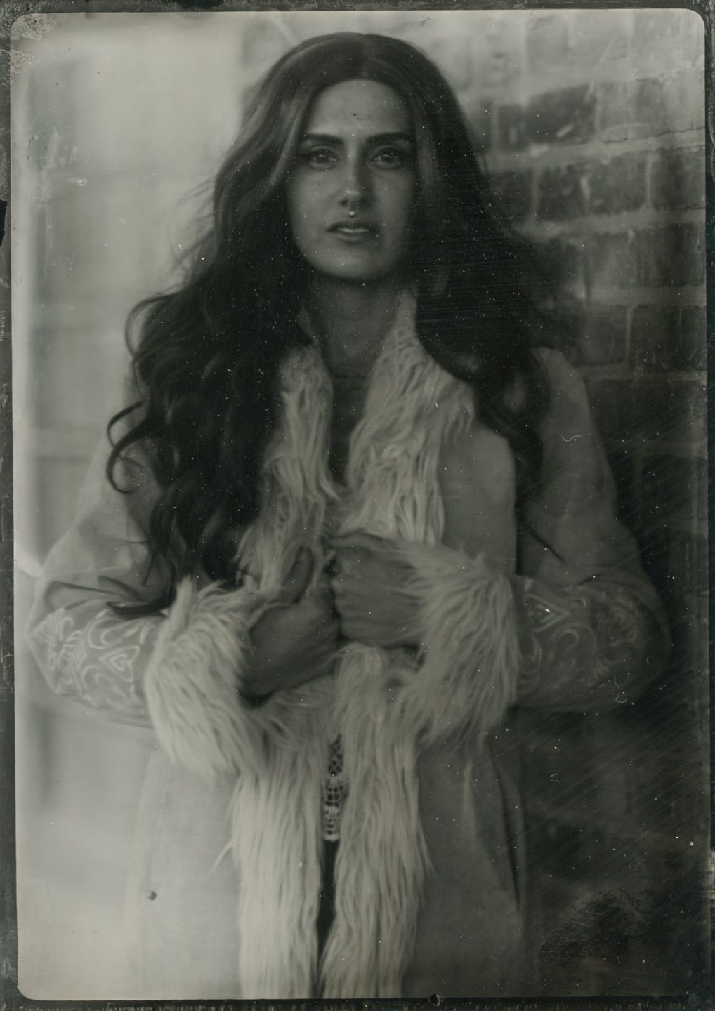 tintype of a female model in a winter coat